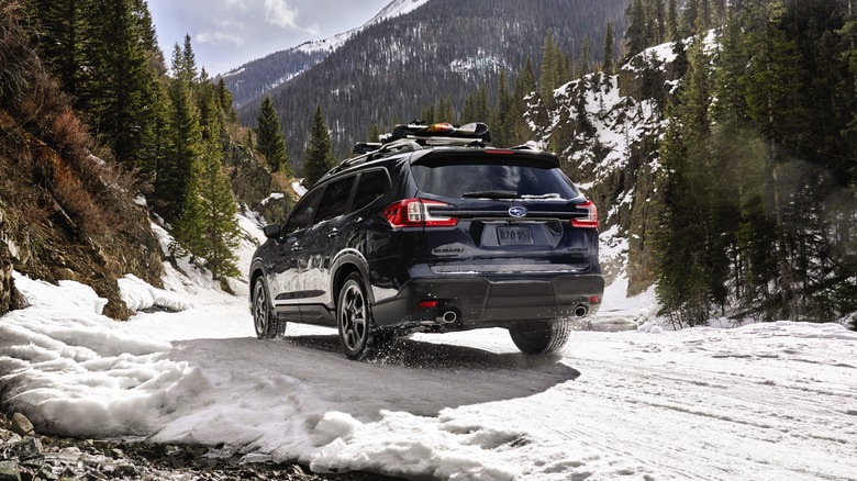 Subaru Ascent driving on snow seen from rear 3/4 angle