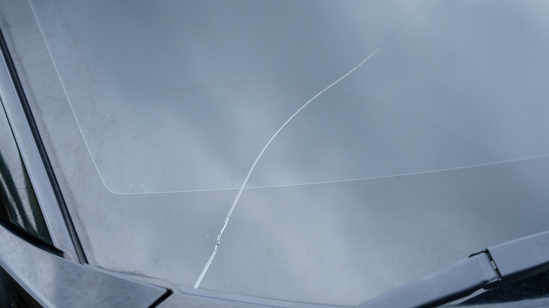 Close-up image of a cracked windshield.