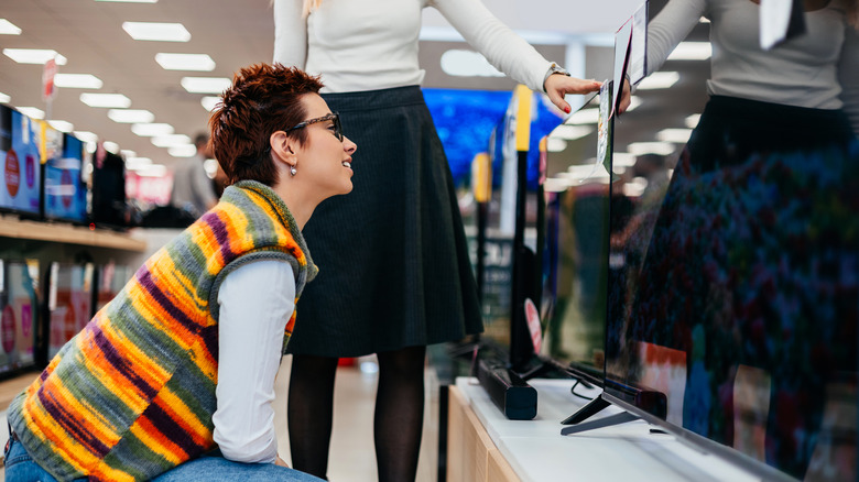 Person browsing televisions