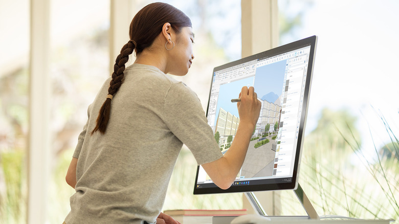 Person using Microsoft Surface Studio 2+