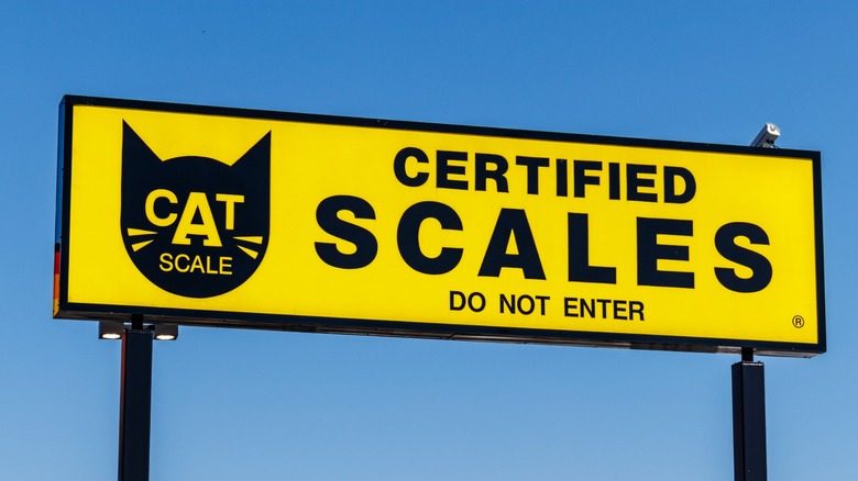 The sign over a truck stop CAT scale used to weigh trucks and campers.