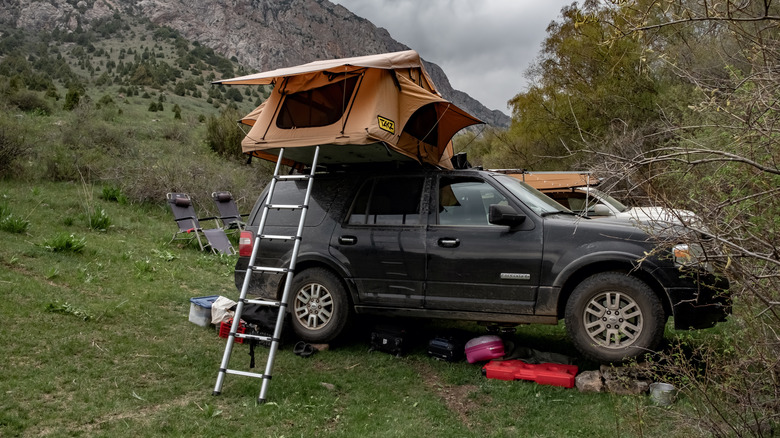Suv with rooftop tent in the outdoors