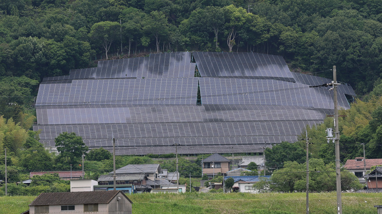 Solar panels installed on a hill in rural Japan