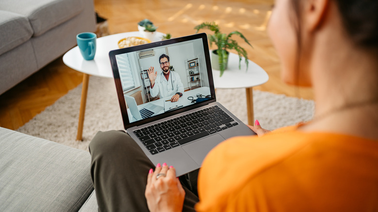 Woman at telemedicine appointment on her laptop
