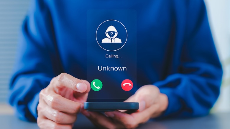 An illustration showing a man in a blue sweatshirt about to answer an unknown call