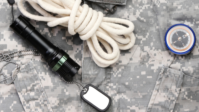 A flashlight with military style accessories