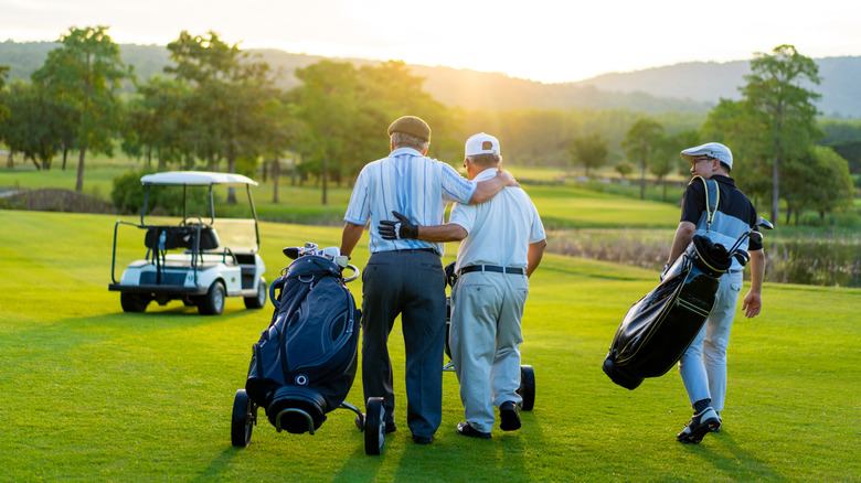A group of golfers on the green