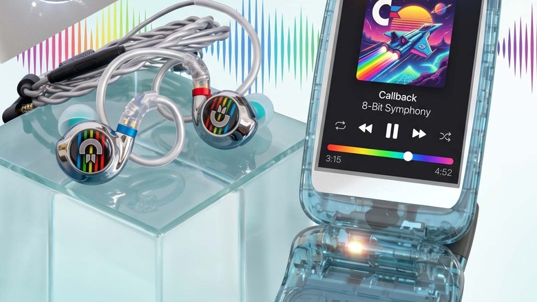 Commodore Callback phone on display next to a pair of wired Commodore earbuds