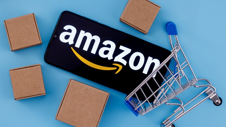 Amazon logo with shopping cart and boxes