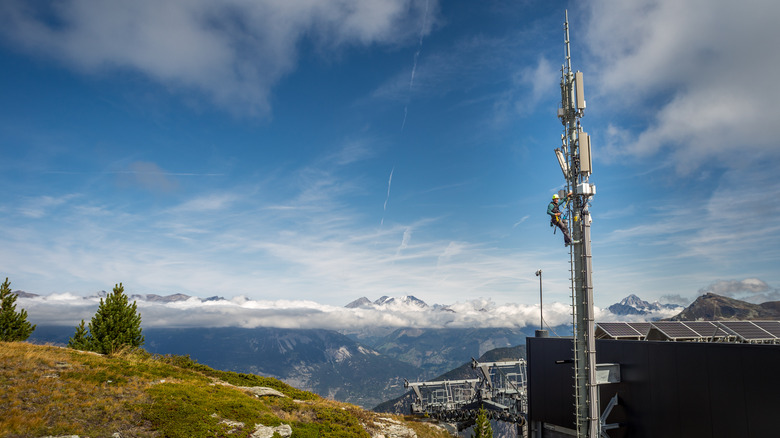 Technician works on an Ericsson cell tower