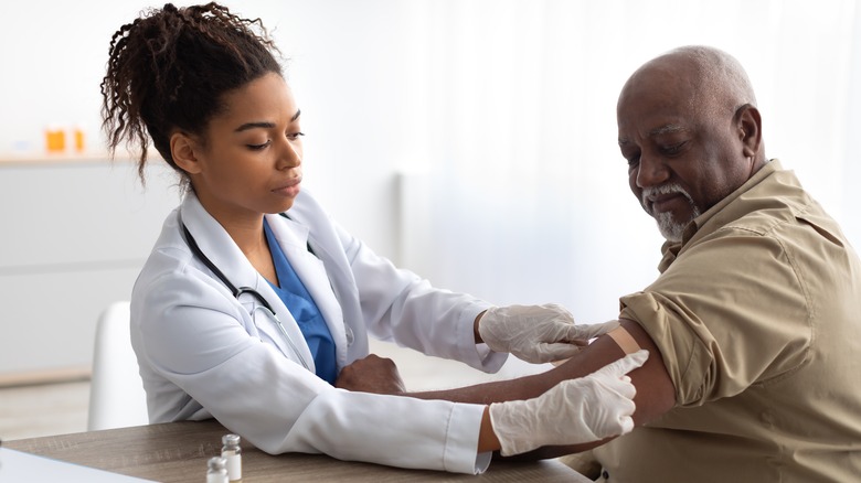 Medical professional vaccinating a patient