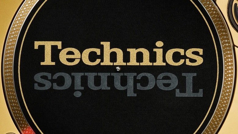 Technics logo in black and gold displayed on a turntable slip mat