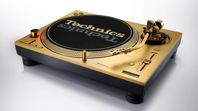 Limited edition Technics SL-1200MK7 turntable displayed with all gold deck and features