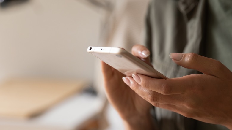 Person holding cell phone