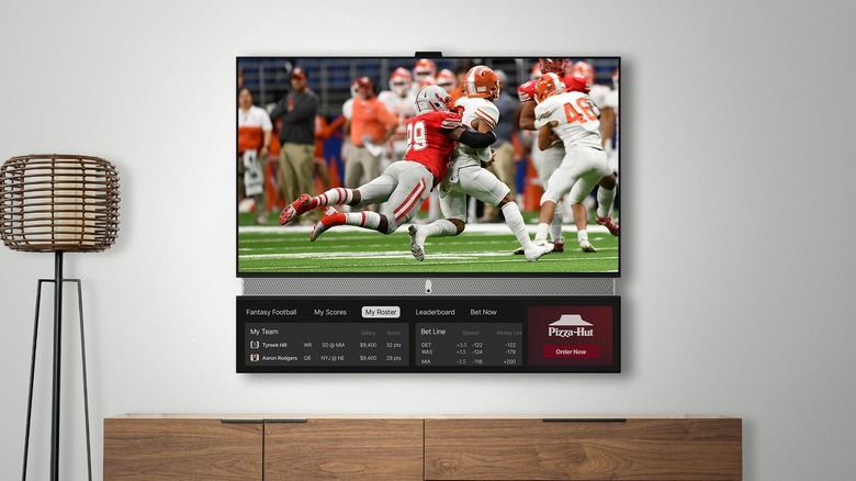 Telly showing football game and scores