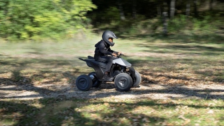 Child riding Tesla Cyberquad