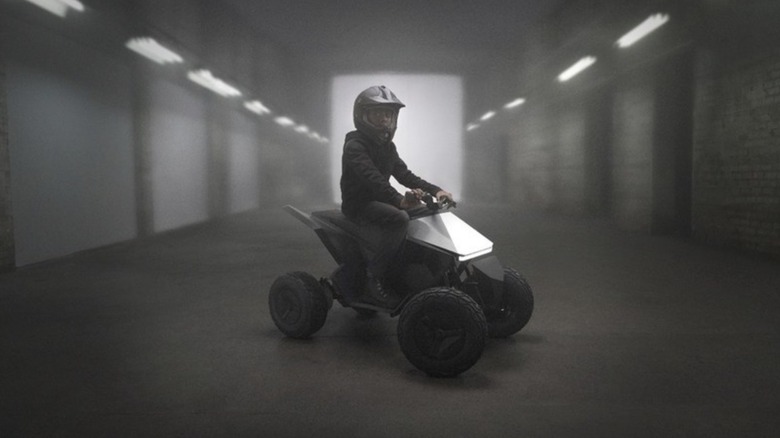 Child riding Tesla Cyberquad