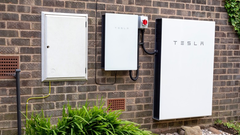 Tesla Powerwall on a brick wall