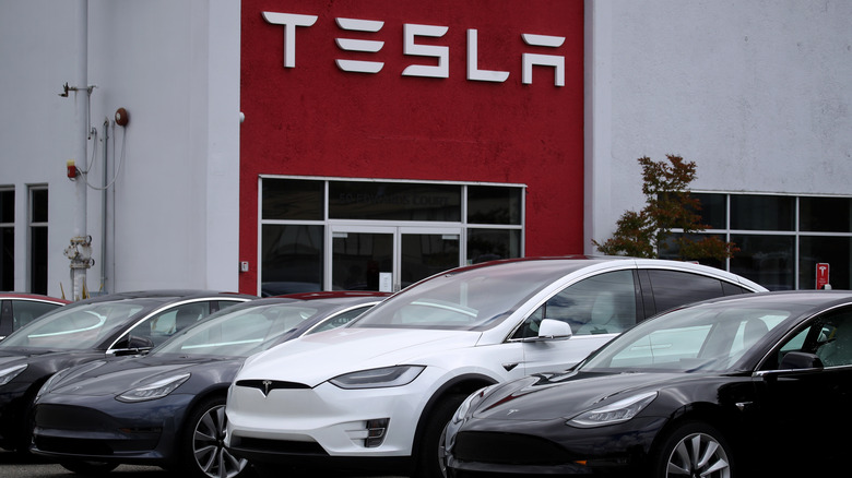 Tesla dealership with cars parked