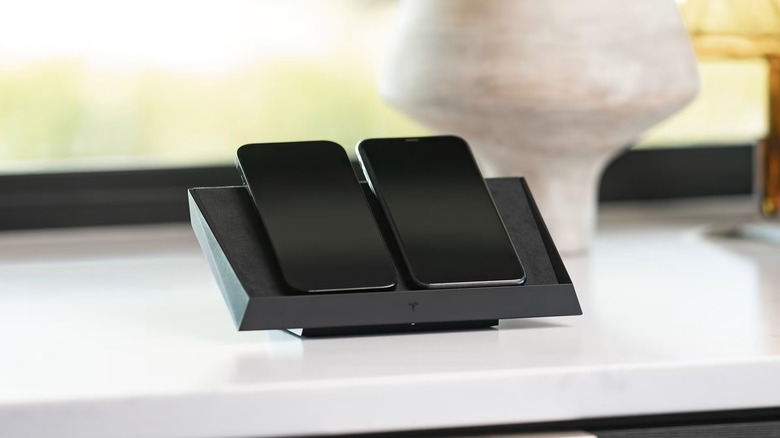 Phones being charged using Tesla Wireless Charging Platform 