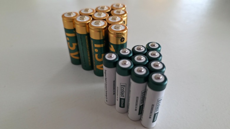 Olight AA and AAA batteries on a white surface