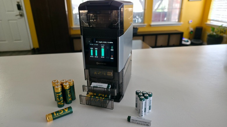 The Ostation Pro 2 with several batteries arranged in front of it and inside its bins