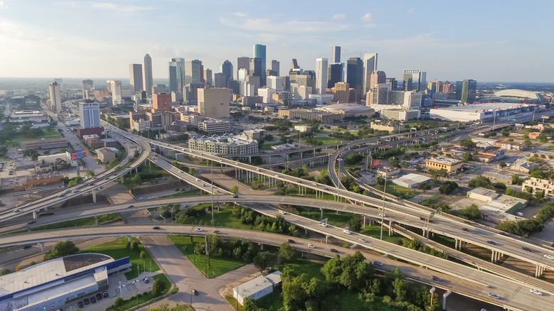 Aerial view of downtown Houston with interstate 45 and 69 highway intersection at sunset