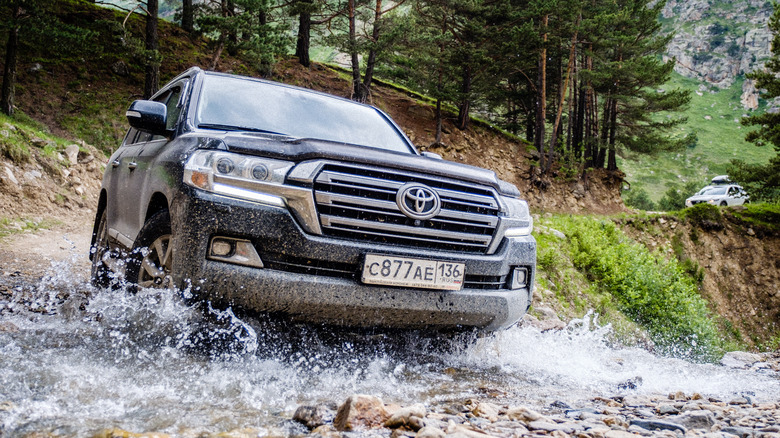 Toyota Land Cruiser crossing a river