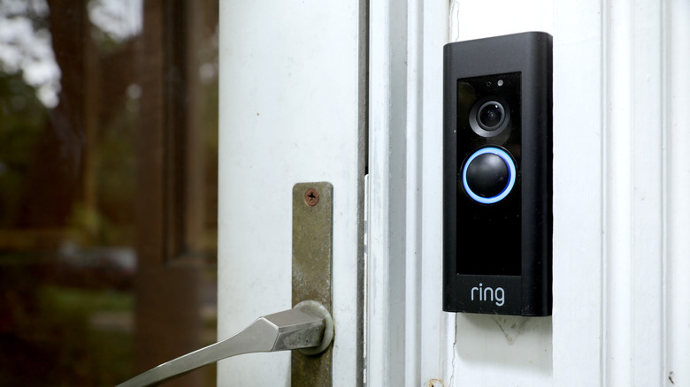 Ring Doorbell installed next to glass door