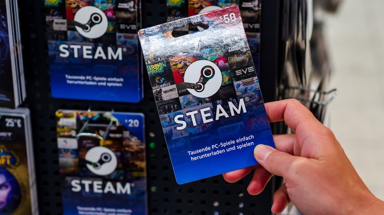 Hand holding STEAM gift card 