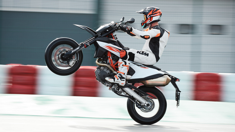 A KTM 690 SMC R pulling a wheelie