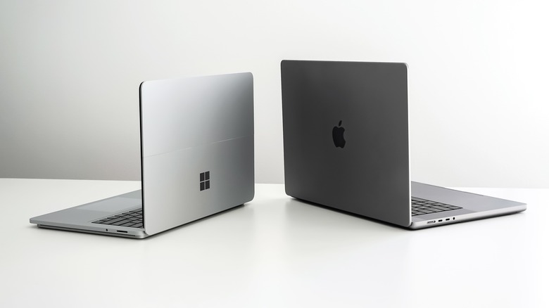 MacBook Pro next to Surface Laptop Studio