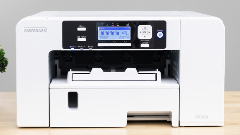 A Sawgrass SG500 Sublimation printer resting on a desk.