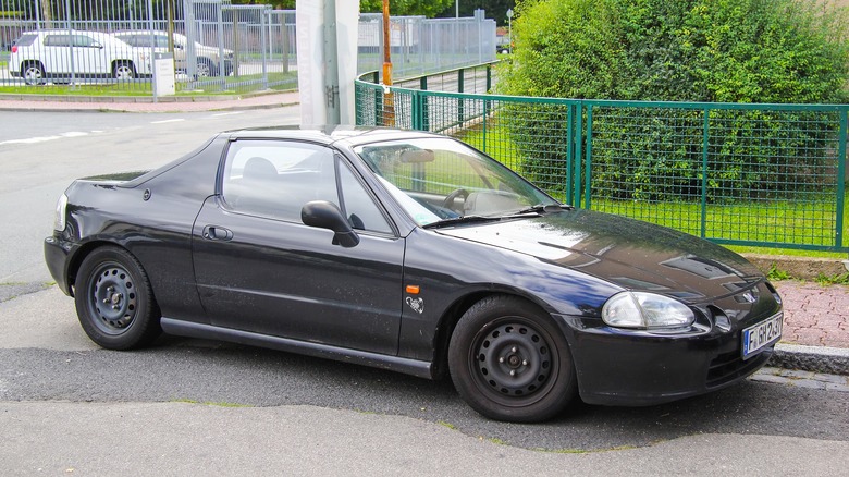 Tatty Honda Del Sol on the road