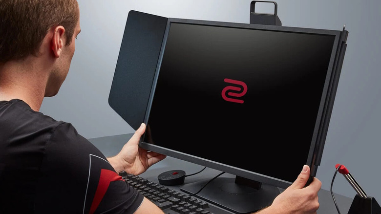 Man adjusting BenQ ZOWIE XL2546K