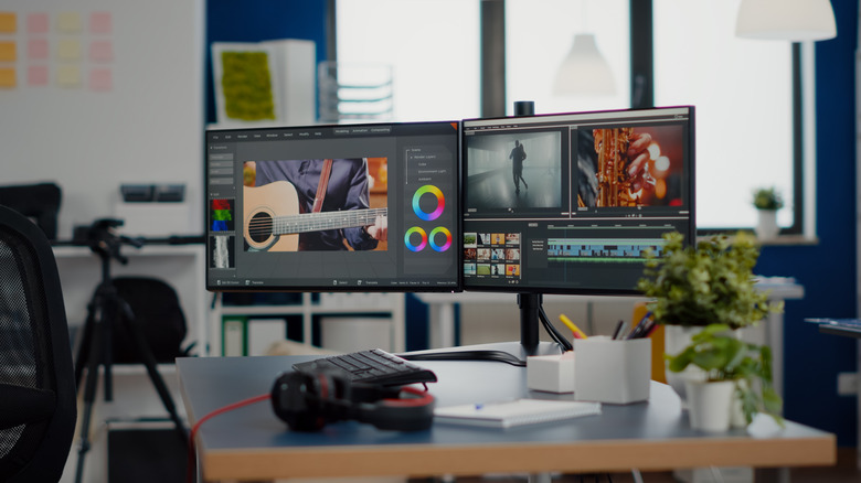 Two different monitors mounted on a desk