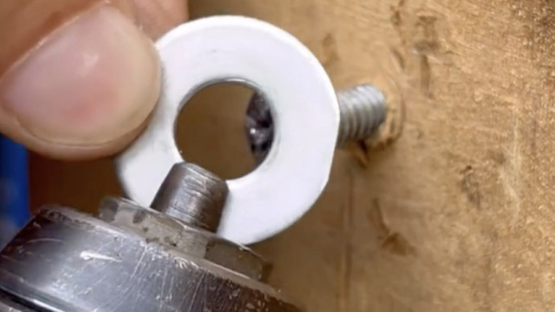 Using a washer to remove stripped screw