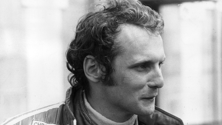 Niki Lauda smiling in his racing gear