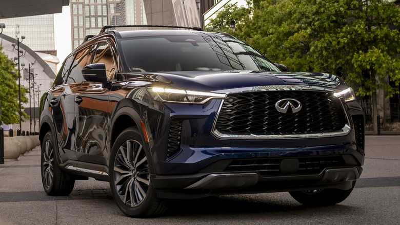 Dark blue Infiniti QX60 parked in a city
