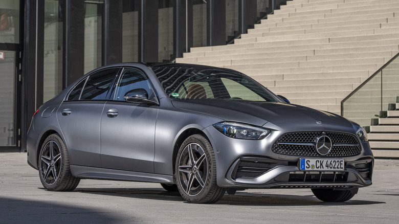 Gray Mercedes-Benz C-Class parked in front of stairs