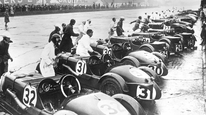 Drivers starting their race cars, 1930s