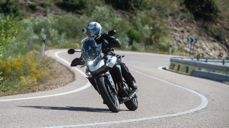 A motorcyclist riding a Triumph