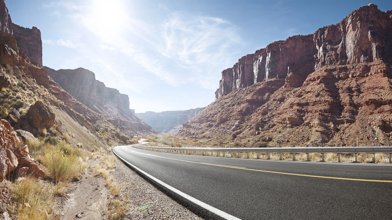 Empty road in Sandstone cliff valley