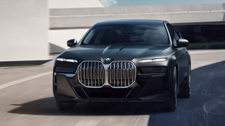 A BMW 7 Series driving on a road
