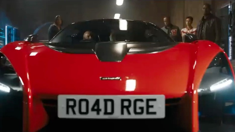 Shaw driving his 2019 McLaren Senna with the license place "R04D RGE" in "Fast X"