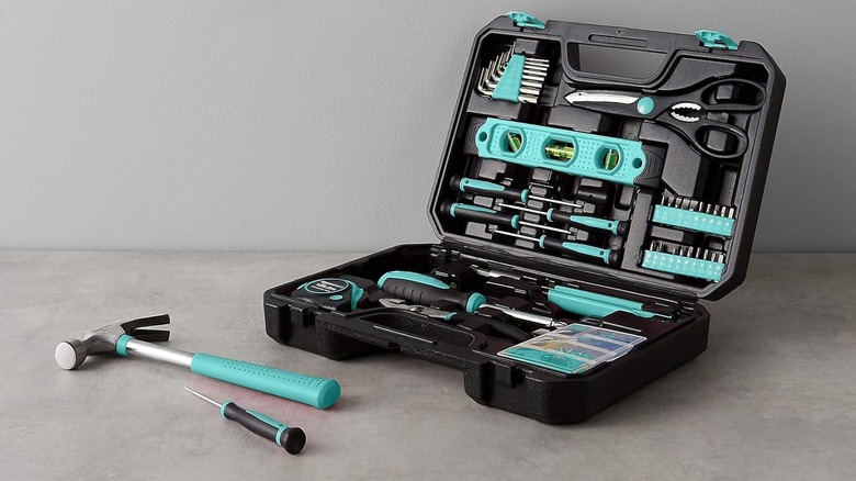 open Amazon Basics black tool case with turquoise tools inside