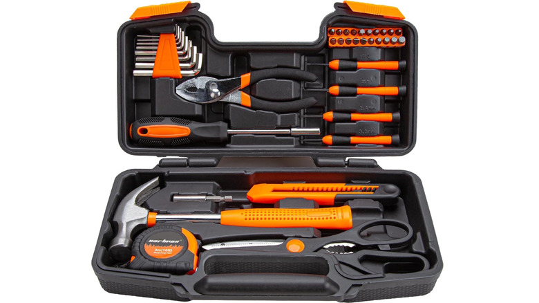 open Cartman black tool case with black and orange tools inside