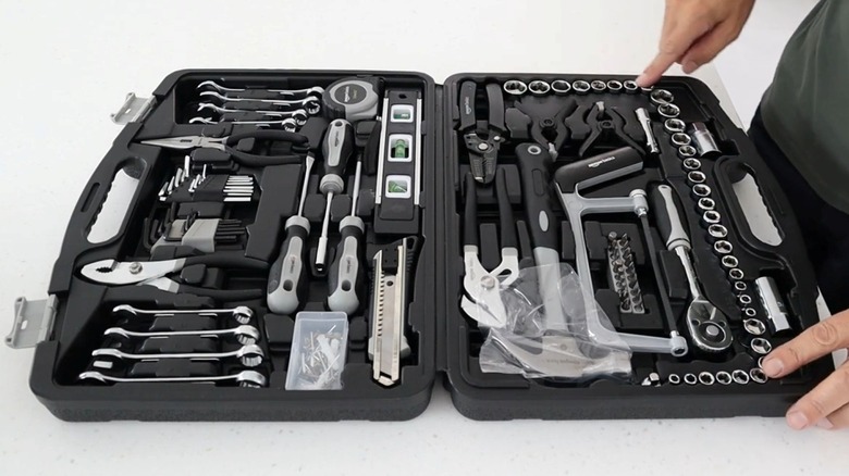 Open tool kit with several tools inside