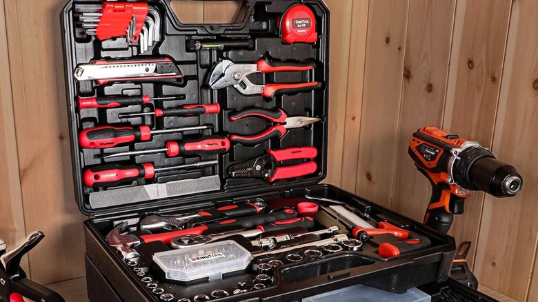 Open KingTool black and red plastic tool case with tools inside