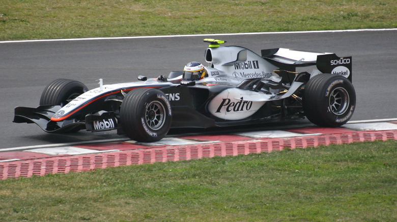 The McLaren MP4-20 being driven by Pedro de la Rosa